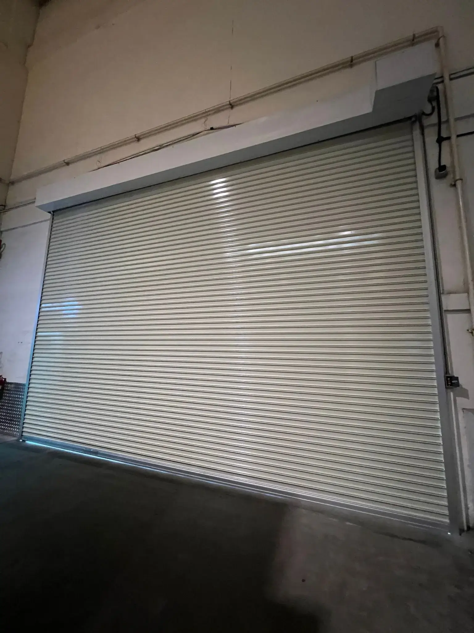 Colorbond industrial roller shutter installation for warehouse in Singapore