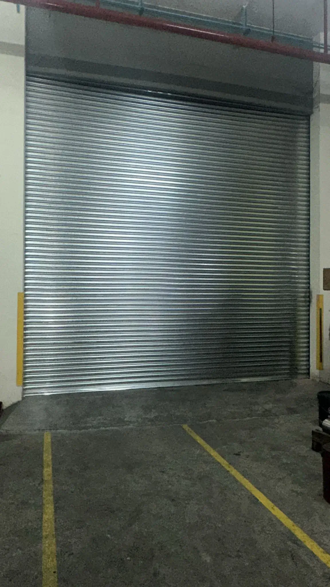 Galvanised industrial roller shutter installation for factory in Singapore
